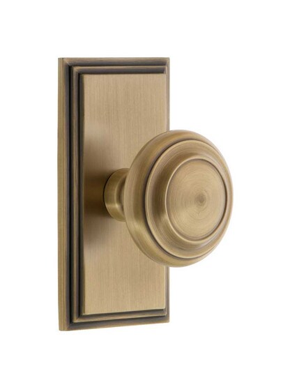 Grandeur Carre Rosette Door Set with Circulaire Knobs in Antique Brass.